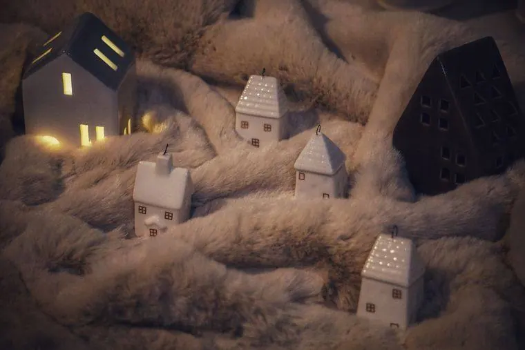 Miniature ceramic houses with warm light